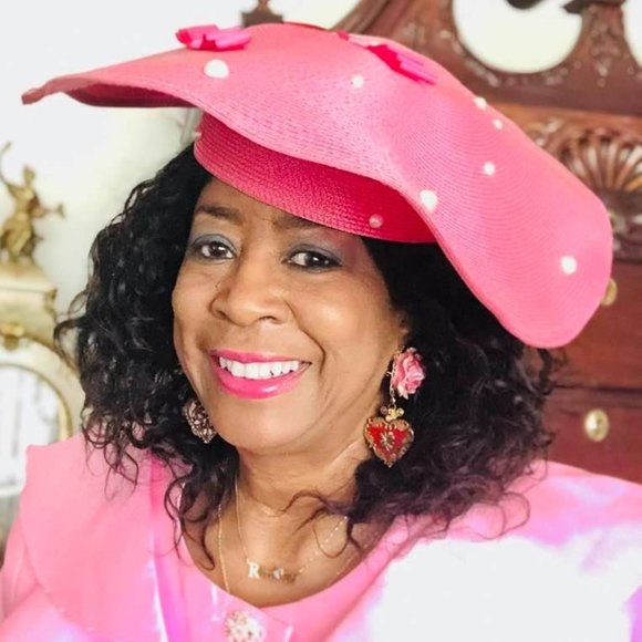 Pink hat embellished with white pearls